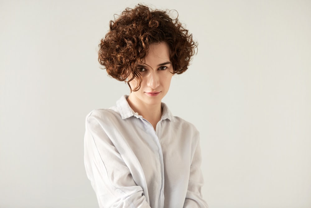 smiling woman with curly hair