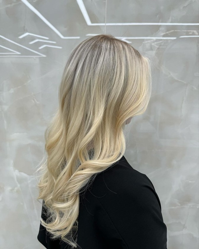Bright blonde highlights with dimension kept through the roots, foiled at HairSocial