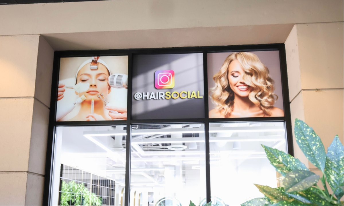 The HairSocial storefront with lit display screens at Tysons Galleria on International Drive