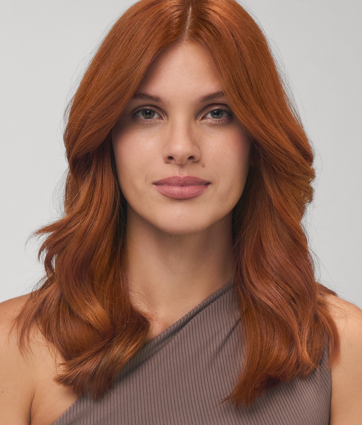 Copper ammonia-free hair color result with soft waves and visible shine