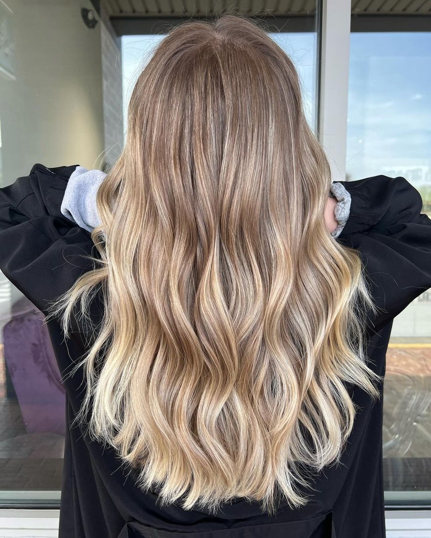 Back view of long blended blonde hair with dimension at HairSocial